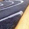 Tapis design vague avec du relief gris foncé et fines vagues en gris clair Tapis design vague avec du relief gris foncé et fines vagues en gris clair