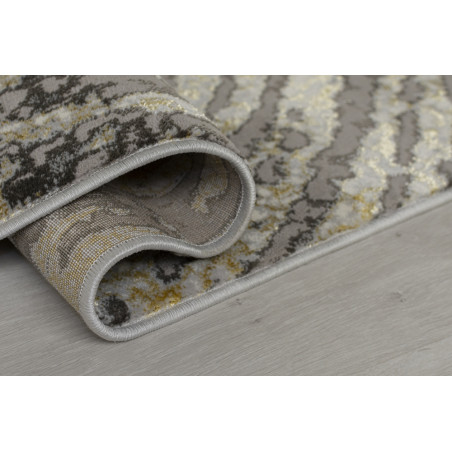 Tapis en fibre synthétique gris et or Tapis en fibre synthétique gris et or