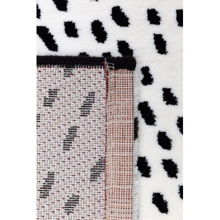 Tapis de salon contemporain Naos points noir sur fond blanc en polyester Tapis de salon contemporain Naos points noir sur fond blanc en polyester