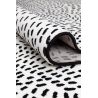 Tapis de salon contemporain Naos points noir sur fond blanc en polyester Tapis de salon contemporain Naos points noir sur fond blanc en polyester