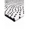 Tapis de salon contemporain Naos points noir sur fond blanc en polyester Tapis de salon contemporain Naos points noir sur fond blanc en polyester