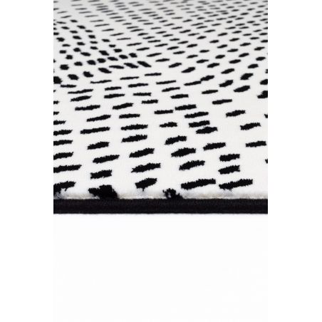 Tapis de salon contemporain Naos points noir sur fond blanc en polyester Tapis de salon contemporain Naos points noir sur fond blanc en polyester