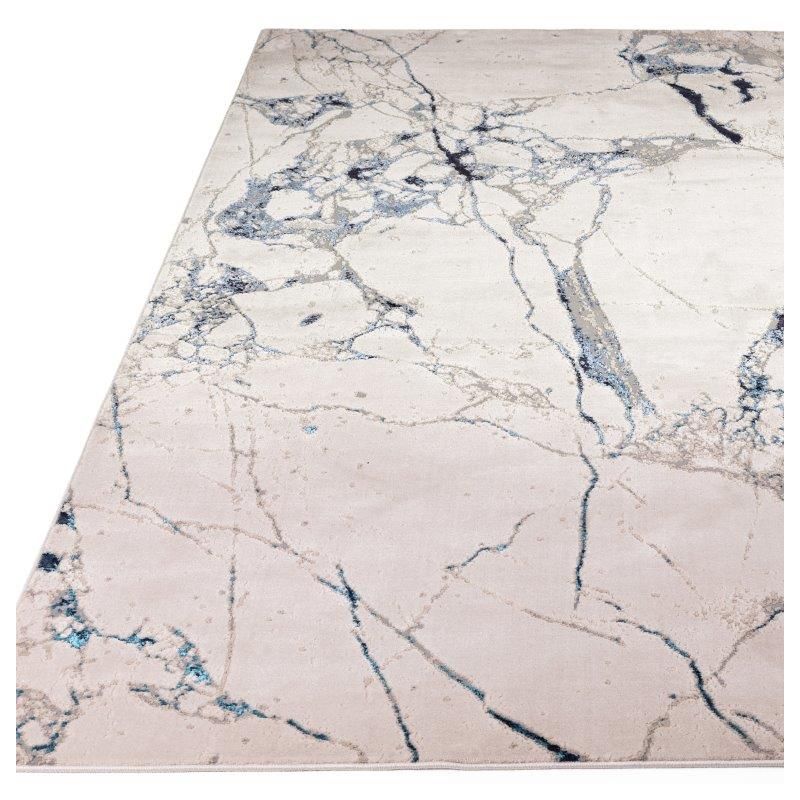 Tapisde salon contemporain polyester Angara Quake nuances de bleu, gris et écru