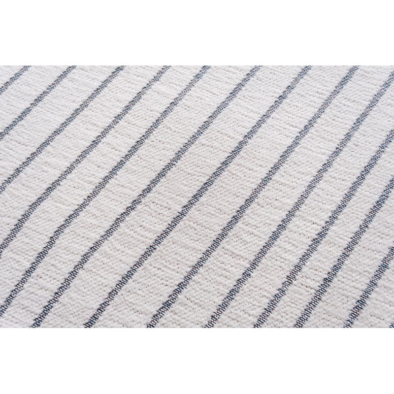 Tapis design tissé plat San Andreas White Grey canapé