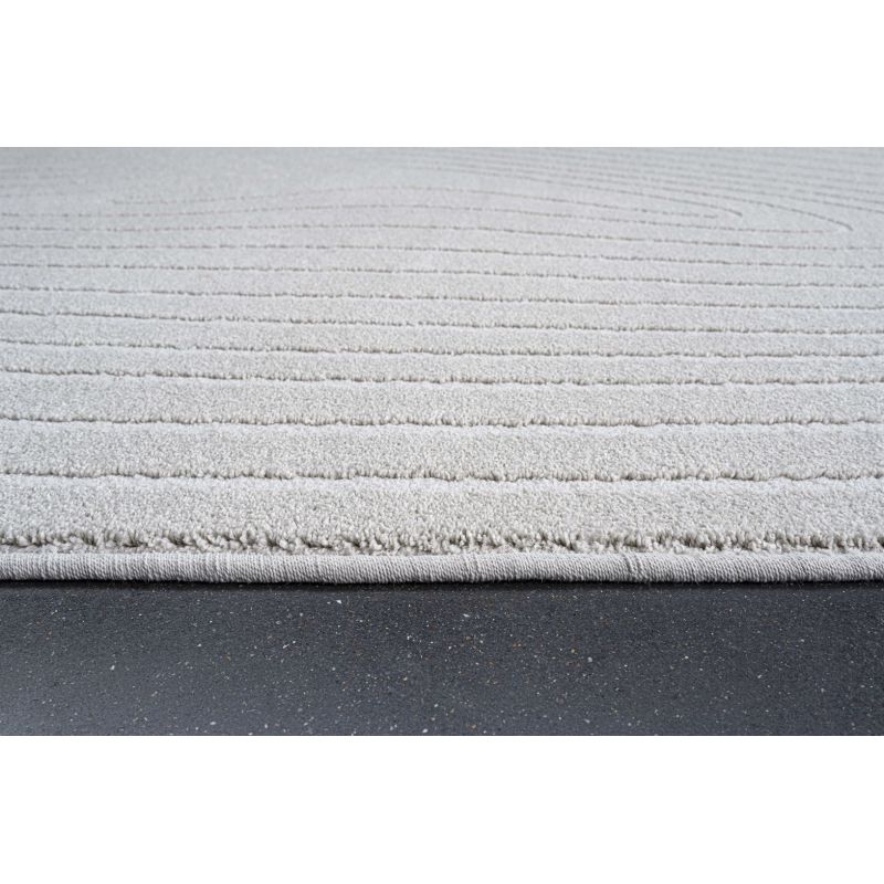 Tapis de salon forme originale galet en fibres synthétiques Halona écru