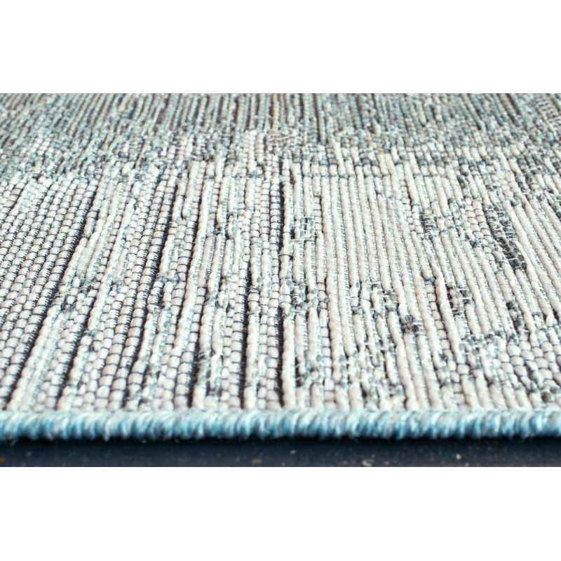 Tapis outdoor/ indoor en polypropylène motifs géométriques Aponi vert d'eau