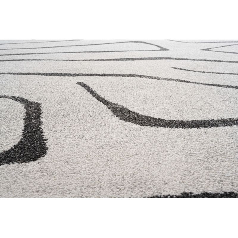 Tapis de salon polyester haut de gamme Magena design motifs noirs sur fond blanc bureau et chambre modernes