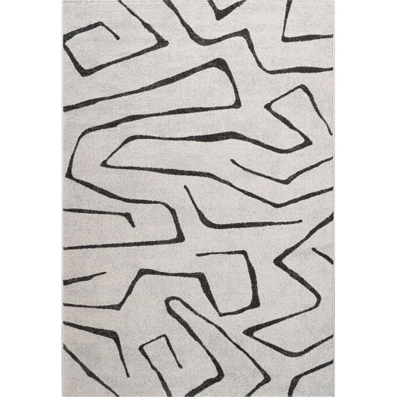 Tapis de salon polyester haut de gamme Magena design motifs noirs sur fond blanc salon