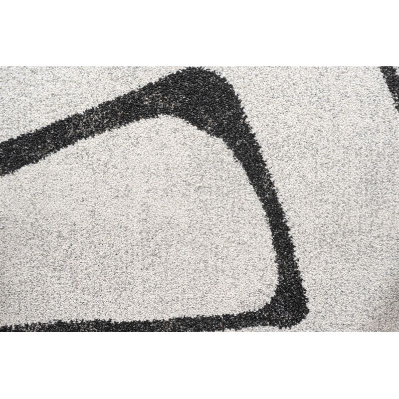 Tapis de salon polyester haut de gamme Magena design motifs noirs sur fond blanc tissé mécanique