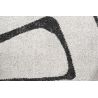 Tapis de salon polyester haut de gamme Magena design motifs noirs sur fond blanc tissé mécanique