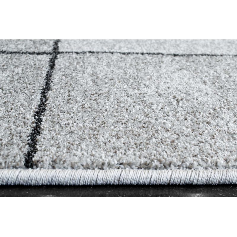 Tapis de salon en polyester Sakari motifs déstructurés ambiance classique tissé machine