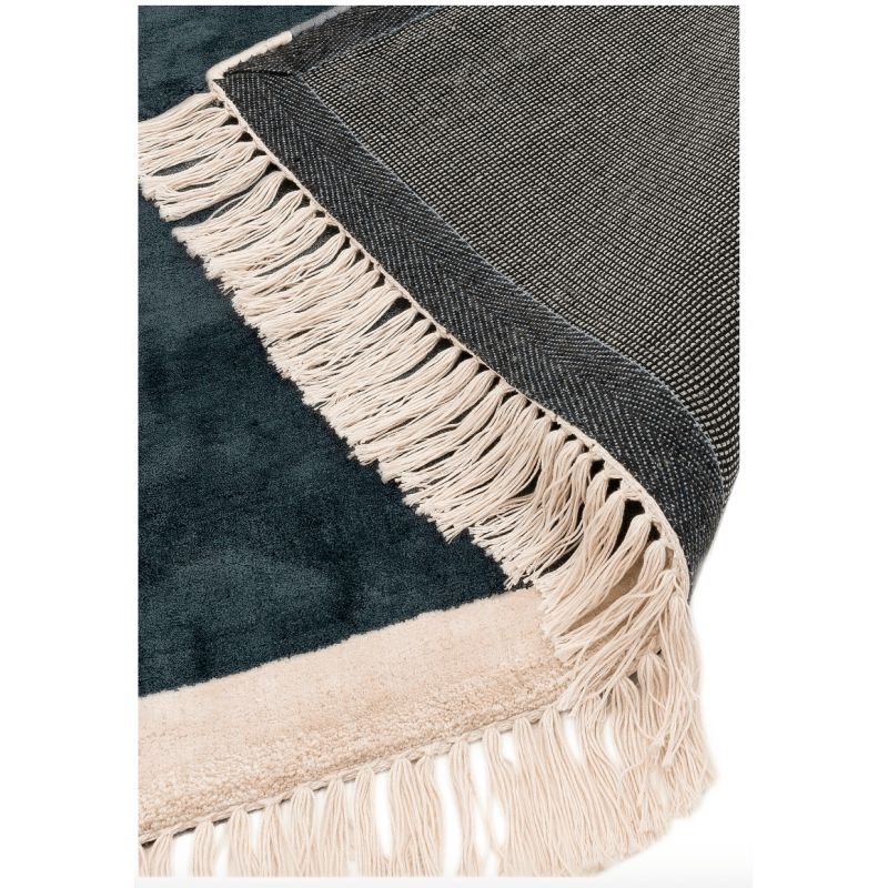 Tapisde salon original en viscosetissé main Mekong bleu pétrole avec franges rose