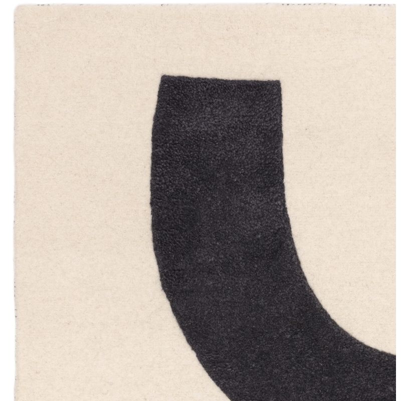 Tapis de salon pure laine noir et ivoire Colombia Balance detail