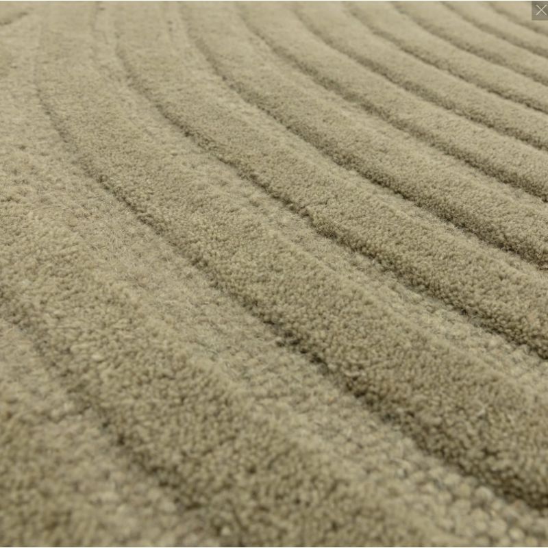 Tapis moderne motifs ronds en relief laine vert sauge Honiara detail