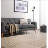 Tapis moderne motifs ronds en relief laine sable Honiara ambiance