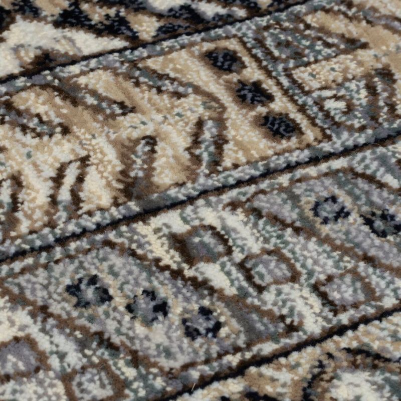 Tapis polypropylène motifs ethniques bleu Babylon motif