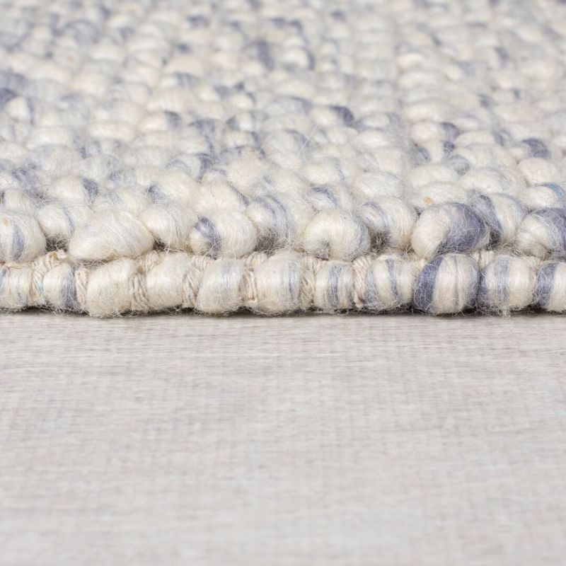 Tapis en laine effet bulles bleu chiné Minerals epaisseur