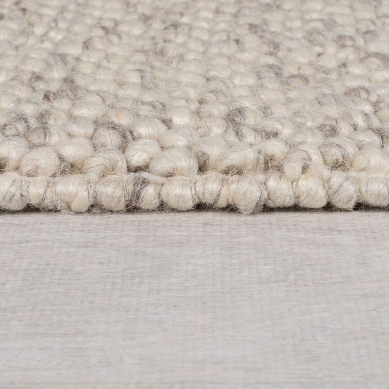 Tapis en laine effet relief beige Minerals Border epaisseur