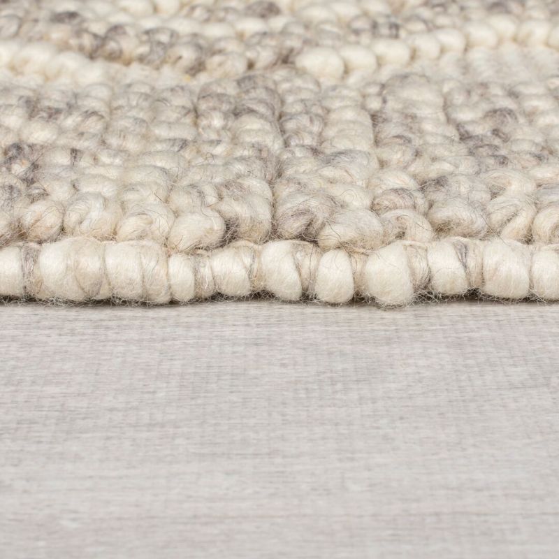 Tapis en laine effet relief beige Border