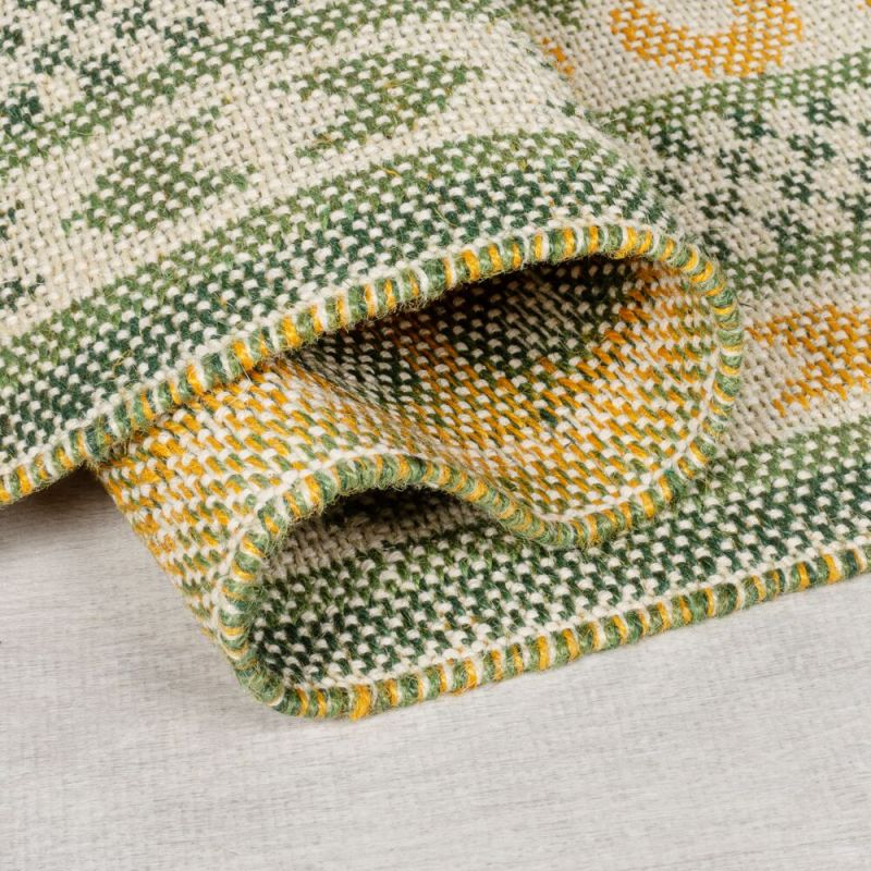 Tapis en jute motif jacquard vert Mara dessous