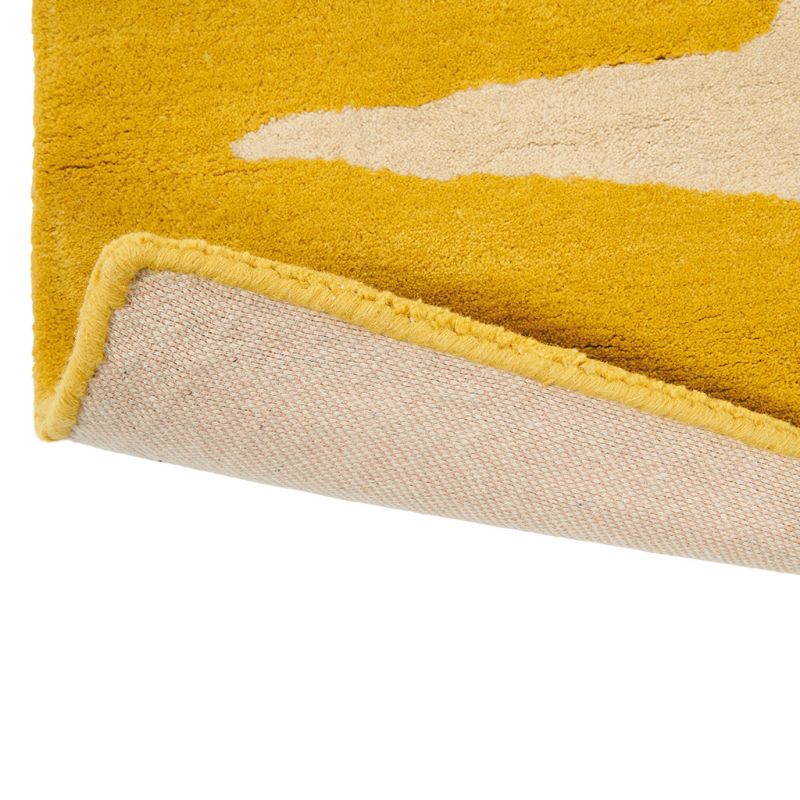 Tapis à motif galet Lohko Honey jaune Scion bordure