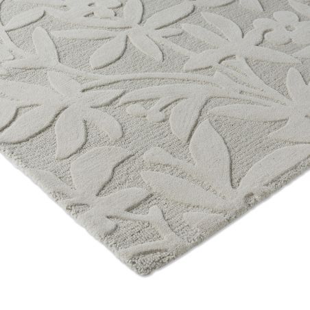 Tapis haut de gamme en laine motif végétal gris détail finitions Tapis haut de gamme en laine motif végétal gris détail finitions