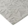 Tapis haut de gamme en laine motif végétal gris détail finitions