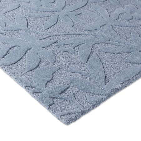 Tapis haut de gamme en laine motif végétal bleu détail angle Tapis haut de gamme en laine motif végétal bleu détail angle