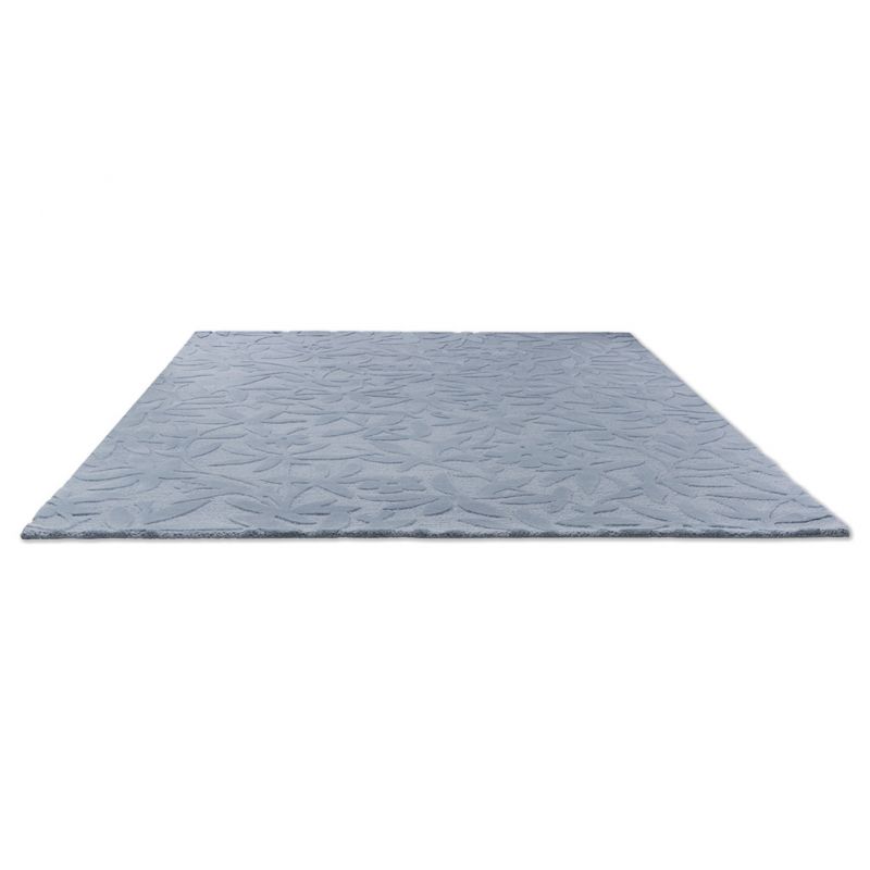 Tapis haut de gamme en laine motif végétal bleu à plat