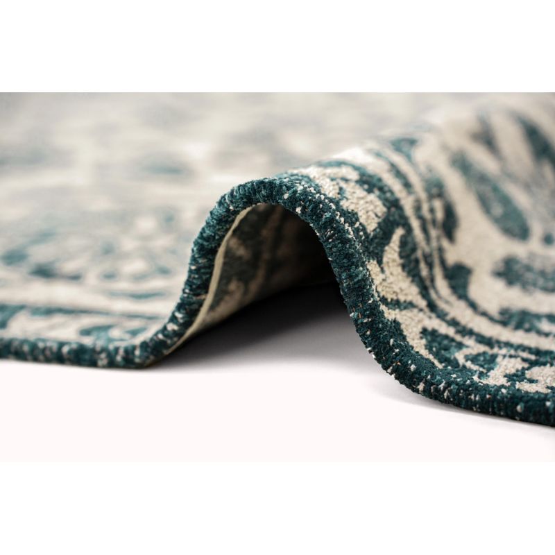 Tapis de salon Suzani Notos beige et bleu canard détail surjet