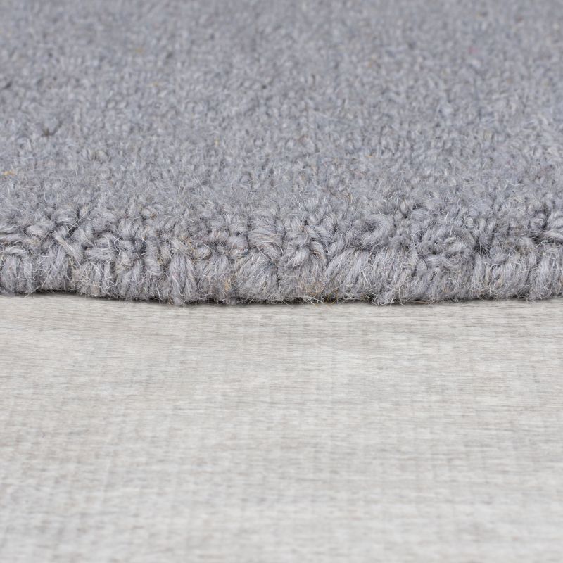 tapis de salon en laine multicolore Abstract Mia détail bordure