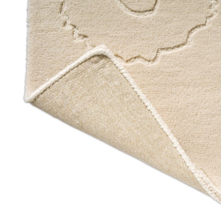 Tapis haut de gamme en laine écru Piirto floral par Marimekko replié
